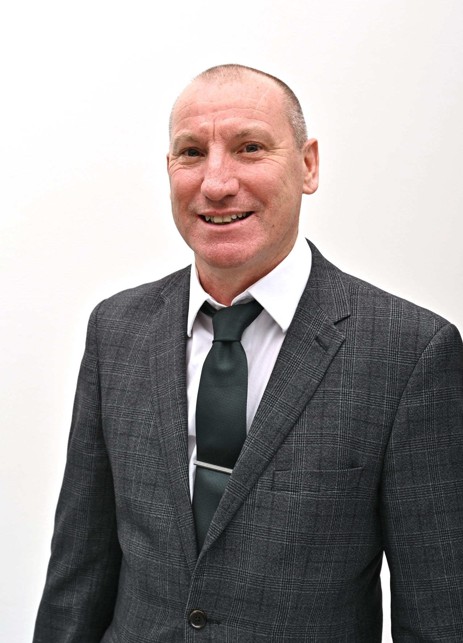 An image of our director Paul Moody a White man in a grey suit