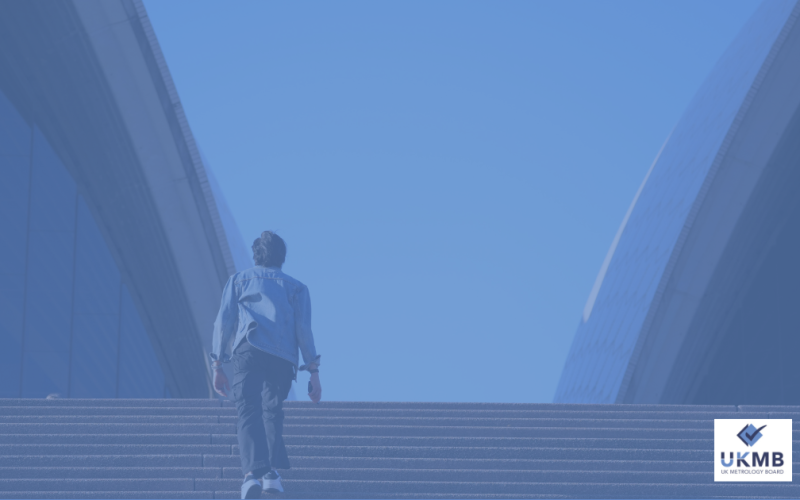 A man walking up stairs in London